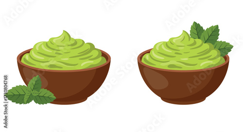 Two servings of vibrant green avocado cream with fresh mint garnish