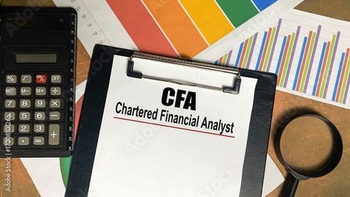 CFA - Chartered Financial Analyst writing on notebook.
