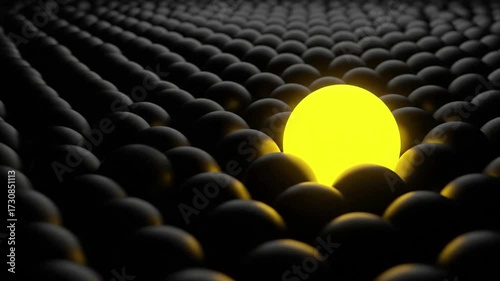 A single glowing yellow sphere stands out among a vast crowd of dark, uniform orbs, symbolizing individuality.