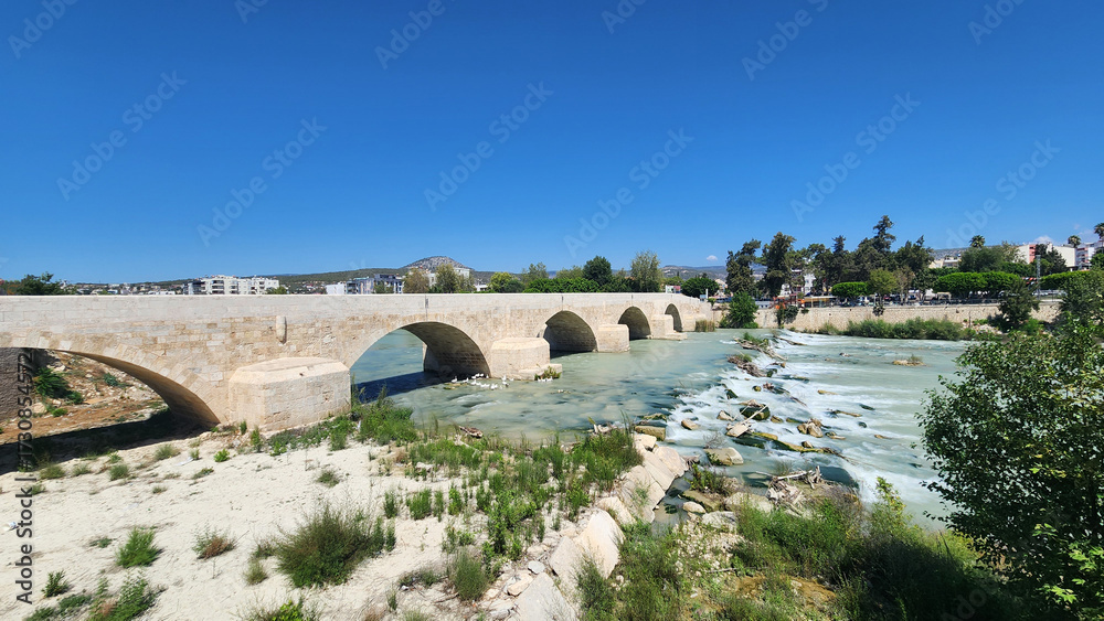 Fototapeta premium In Silifke, Taşköprü (literally Stone Bridge), originally built in 77-78 AD for Emperor Vespasian, and modernized over centuries, with its 5 arches now resting on original foundations