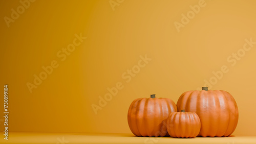 Pumpkins on a orange background, autumn and Halloween decorations