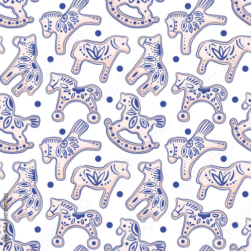 A Christmas pattern of cookies with blue ornaments and polka dots. Winter homemade figurines of the symbol of the year. For banners, background, wrapping, cards, fabric, textiles.