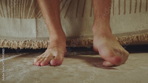 The man crunches his toes