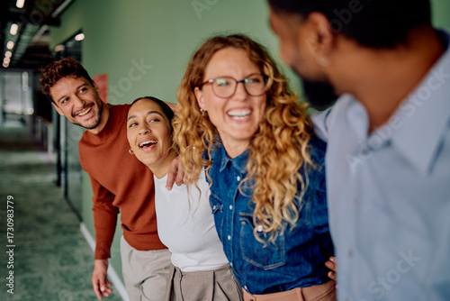 Fotografie Diverse group of smiling business teammates showing unity, friendship, and posit