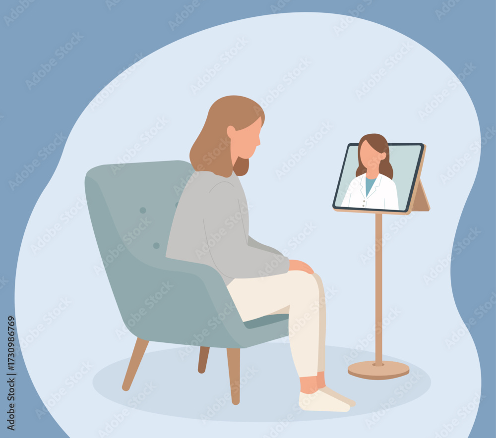 Fototapeta premium A woman sits in a chair having an online consultation with her doctor via a video call on a tablet, representing modern telemedicine and virtual healthcare