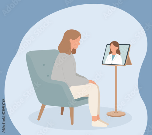 A woman sits in a chair having an online consultation with her doctor via a video call on a tablet, representing modern telemedicine and virtual healthcare