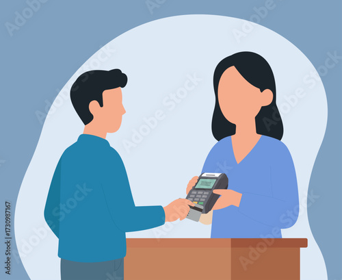 A customer makes a cashless payment with a credit card at a counter. The female cashier holds the POS terminal for a quick and easy transaction