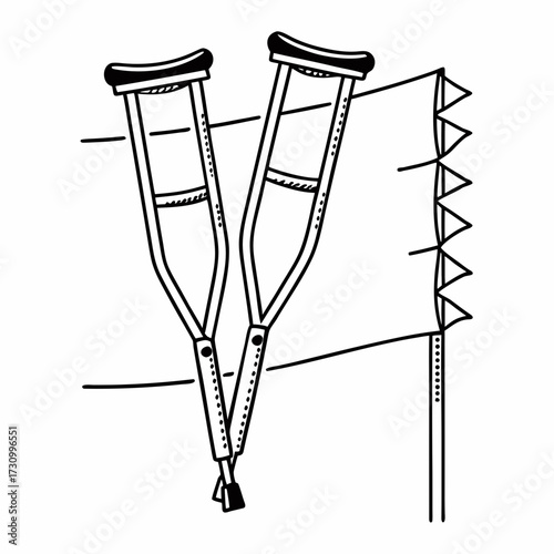 Crutches leaning against wall with tape and notepad nearby  