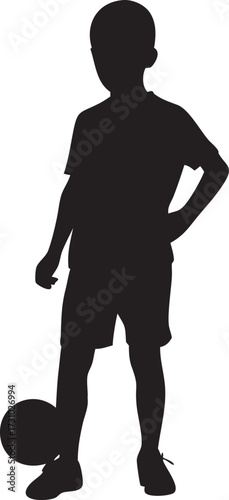 Silhouette of a young boy in athletic wear holding a soccer ball ready to play