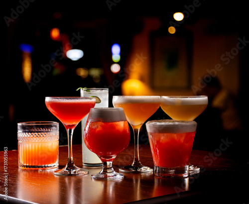 collection of colorful cocktails and drinks with pub on warm light blur background