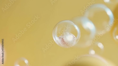 joyful child dances among floating soap bubbles laughing with pure delight against soft yellow background