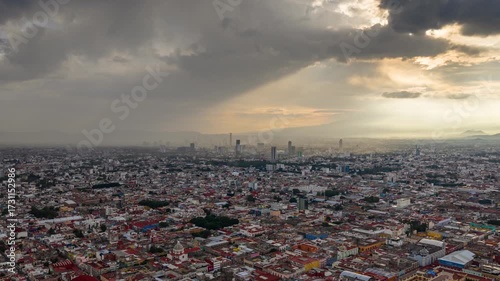 Puebla City at Sunset with Dramatic Cloudscape. Drone Aerial