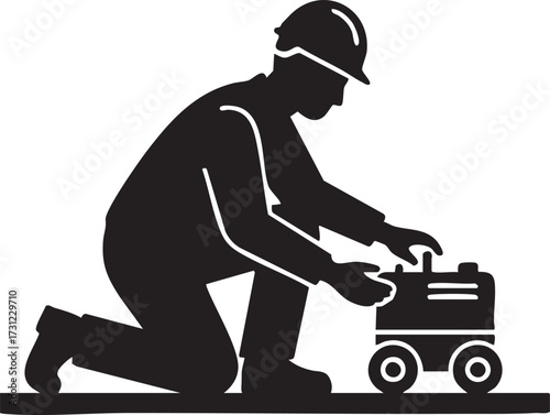Silhouette construction worker in a hard hat kneeling and working on a wheeled toolbox isolated on white background
