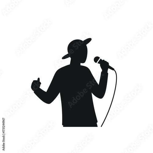 Silhouette of a person singing into a microphone