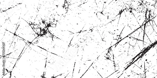 Black and white grunge wall texture with a subtle ink splatter pattern for a dirty, old paper backdrop design