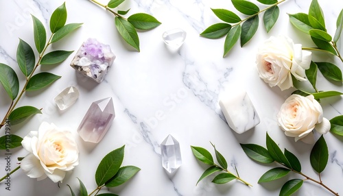 Crystals, roses, and leaves on marble