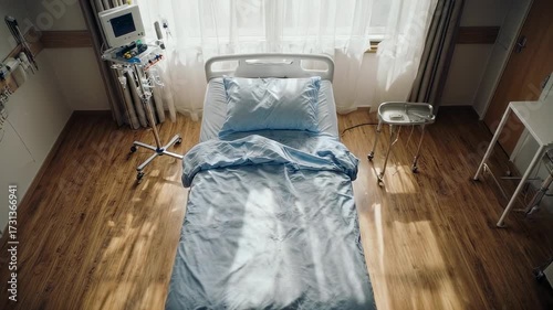 Empty hospital bed in light-filled room, symbolizing healthcare, recovery, or medical equipment, suitable for backgrounds, website design, and marketing