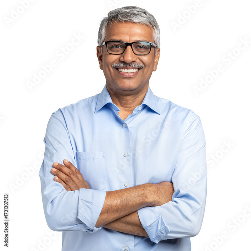 Happy confident mature Indian man with eyeglasses smiling at camera, arms crossed, on an isolated transparent background.
