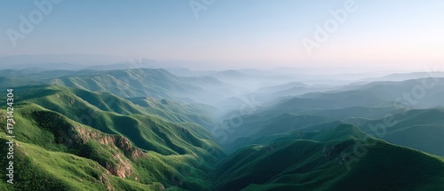 Mountain Valley View Under Clear Blue Sky with Lush Green Vegetation