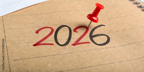 Year 2026 Marked with Green and Red Push Pins on Brown Paper