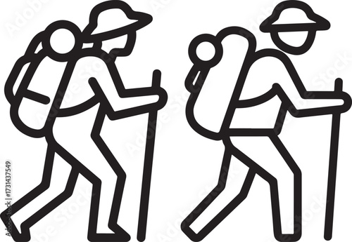 Two hikers with backpacks and walking sticks silhouette