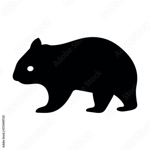 Silhouette of a wombat with a bright white eye