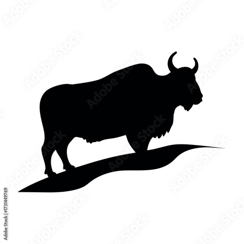 Silhouette of a powerful yak standing on a rocky outcrop against a white background