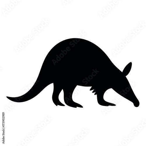 Silhouette of an aardvark foraging with its snout low to the ground