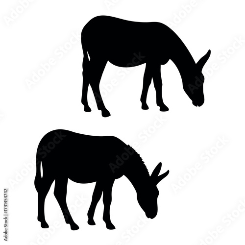 Two black silhouettes of donkeys grazing on a white background