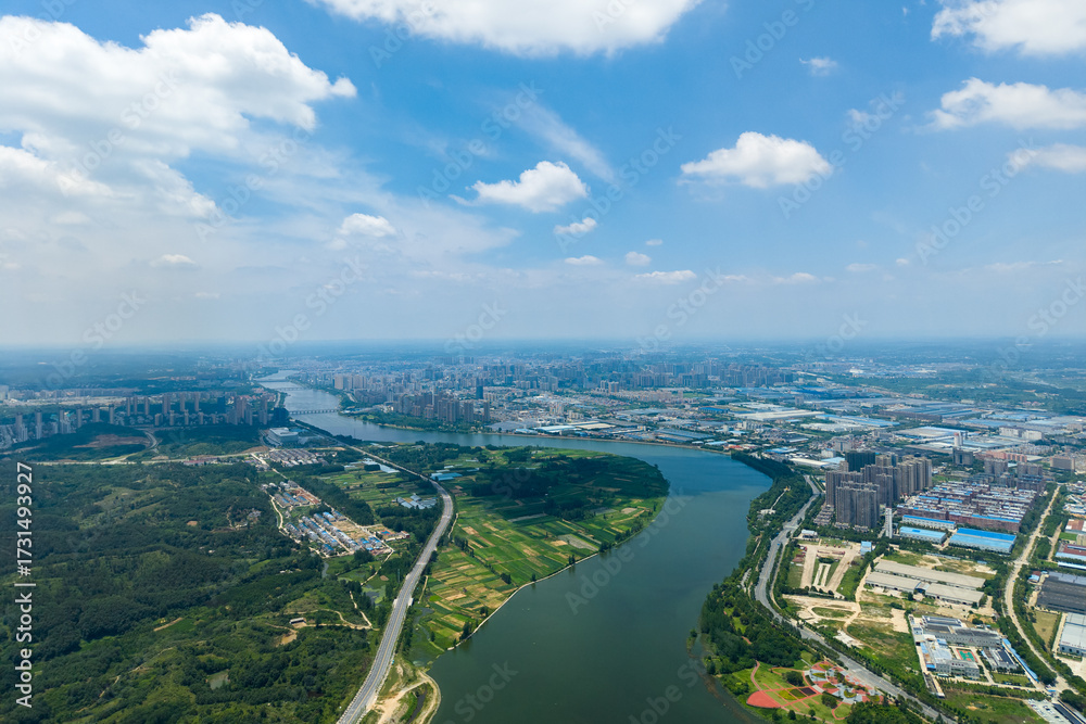 Obraz premium Suizhou City river winds through Hubei Province China landscape under cloudy sky.