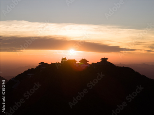 Dahong Mountain structures against a sunset sky in Suizhou, China.