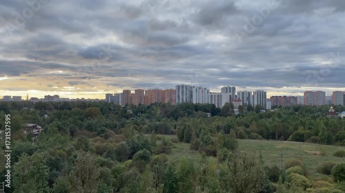 A Beautiful Urban Landscape Featuring Lush Greenery Set Against a Cloudy Sky Above
