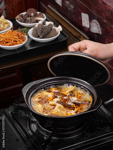 Wallpaper Mural Traditional Yunnan Mushroom Soup with Colorful Ingredients and Buns in Clay Pot Torontodigital.ca