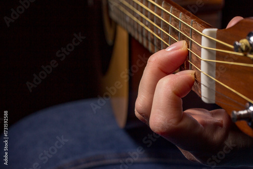 chord clamped on guitar, A minor, hand clamped chord, music learning. lifestyle