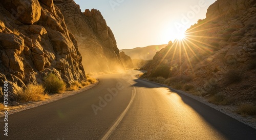 Scenic road winding through golden canyons under bright sunlight creating a sense of journey travel adventure
