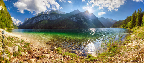 Fototapeta Naklejka Na Ścianę i Meble -  Peaceful scene of Vorderer ( Gosausee ) lake with Dachstein glacieron background. Picturesque evening view of Austrian Alps, Upper Austria, Europe. Traveling concept background.