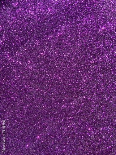 Purple glitter texture with rough sparkle and dynamic light play — festive, abstract, glamorous surface for design, fashion, or fantasy themes