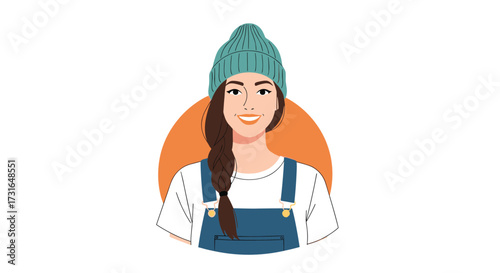 Young woman wearing a teal beanie and denim overalls smiling.