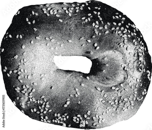 Close-up black and white image of a sesame seed bagel with a hole in the center