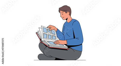 Young man sits cross-legged flipping through pages of a photo album filled with past memories and moments captured forever within the pages