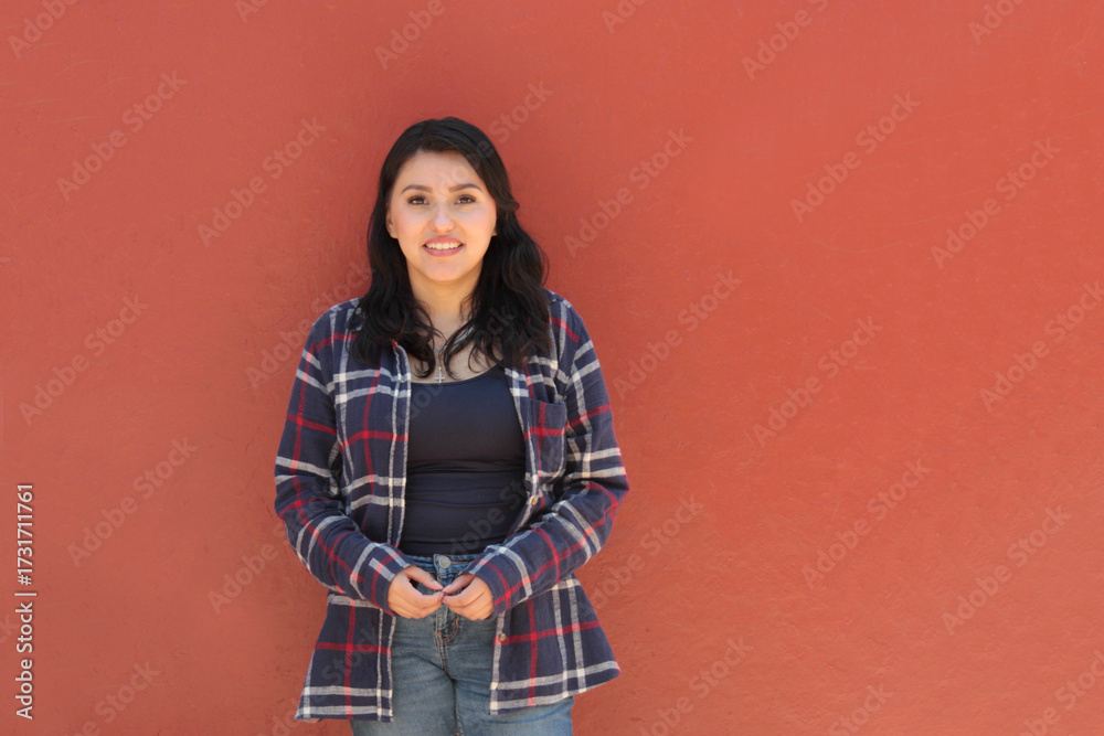 Φωτογραφία Young Latina woman appears happy and empowered, celebrating life in fullness and