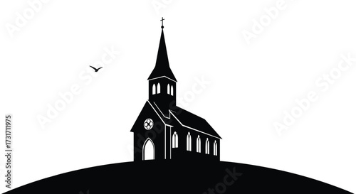A simple church silhouette stands against a clear sky on a hill.