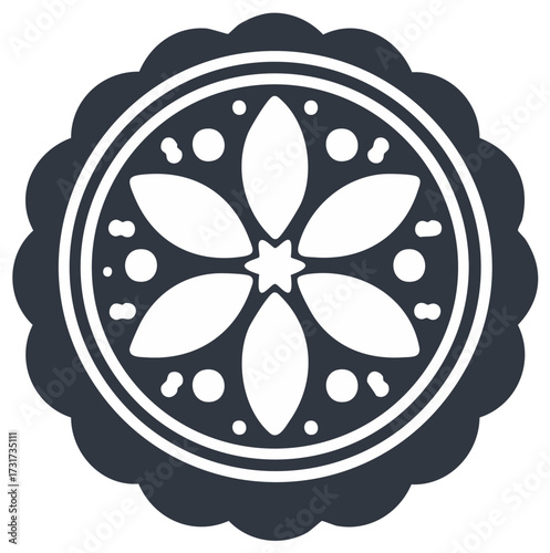 Stylized dark floral mandala design with scalloped edges and inner dot patterns