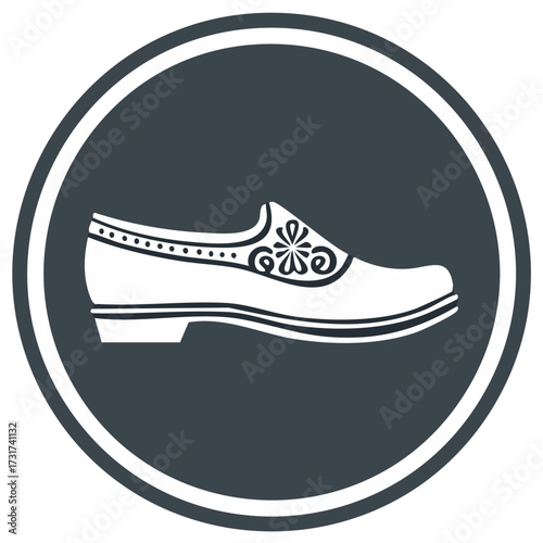 White decorated low-heeled shoe silhouette inside a dark circle with white border
