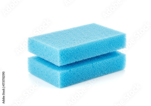 Two bright blue cleaning sponges stacked neatly on a clean white background, ready for household chores and deep cleaning tasks.