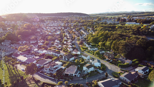 Aerial photo showcasing the entire residential area and townscape of Dalgety Bay, Fife, Scotland. High-angle view perfect for depicting coastal town planning and suburban life.