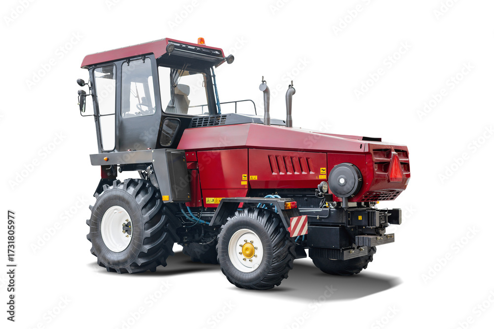 Naklejka premium Agricultural tractor in striking red color with robust tires, designed for various farming tasks, isolated against a clean white backdrop, emphasizing its sturdy build.