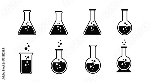 A collection of black and white laboratory glassware with liquid contents