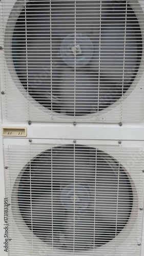 This modern AC unit has an innovative design with dual fans for efficient climate control