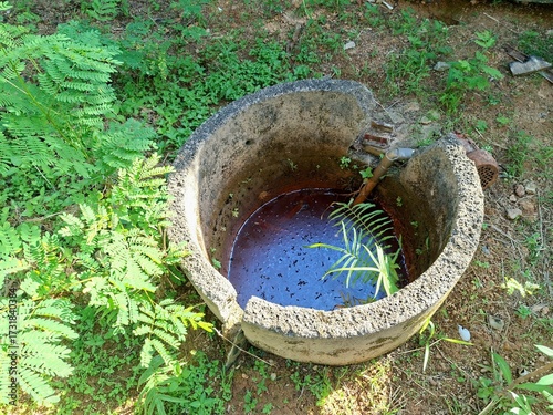 The well is old and damaged